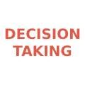 A red sign that says decision taking.